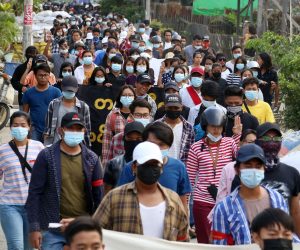 epa09123470 Demonstrators march during an anti-military coup protest in Mandalay, Myanmar, 09 April 2021. According to the Assistance Association for Political Prisoners (AAPP), at least 570 people have been killed by Myanmar armed forces since the military seized power on 01 February 2021 while protests continue despite the intensifying crackdown on demonstrators.  EPA/STRINGER