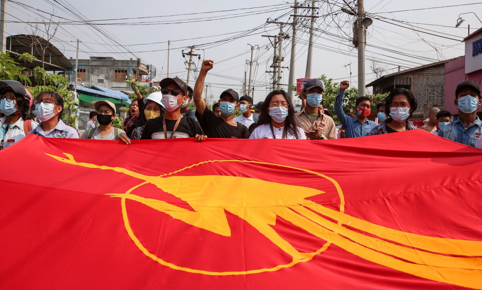 epa09131954 Demonstrators display a student union flag as they march during an anti-military coup protest in Mandalay, Myanmar, 13 April 2021. Myanmar anti-coup activists have called for people to boycott official Thingyan festivities organized by the military junta. The Thingyan Water Festival, the Burmese traditional New Year, is usually celebrated with family reunions and water-throwing festivities. According to the Assistance Association for Political Prisoners (AAPP), at least 700 people have been killed by Myanmar armed forces since the military seized power on 01 February 2021. Protests continue despite the intensifying crackdown on demonstrators.  EPA/STRINGER