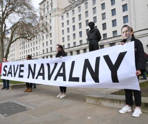 epa09132856 Supporters of detained Russian opposition leader, Alexei Navalny stage a demonstration organized by the group "Art of Rebel" outside Downing Street in London, Britain, 13 April 2021.  EPA/FACUNDO ARRIZABALAGA