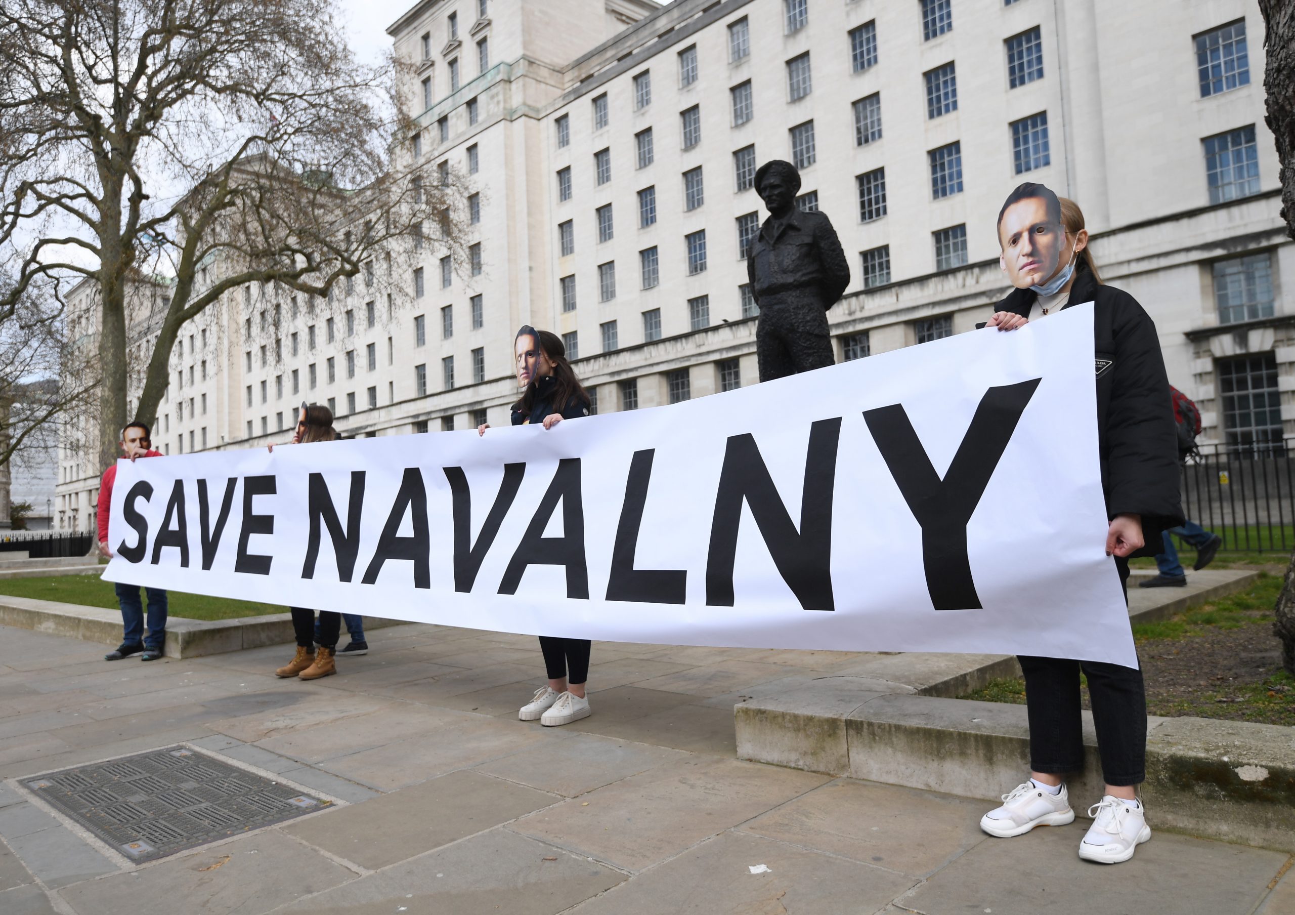 epa09132856 Supporters of detained Russian opposition leader, Alexei Navalny stage a demonstration organized by the group "Art of Rebel" outside Downing Street in London, Britain, 13 April 2021.  EPA/FACUNDO ARRIZABALAGA