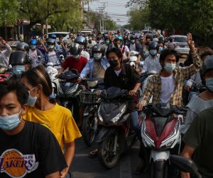 epa09134199 Demonstrators on motorcycles flash the three-finger salute during an anti-military coup protest in Mandalay, Myanmar, 14 April 2021. According to the Assistance Association for Political Prisoners (AAPP), at least 700 people have been killed by Myanmar armed forces since the military seized power on 01 February 2021. Protests continue despite the intensifying crackdown on demonstrators.  EPA/STRINGER