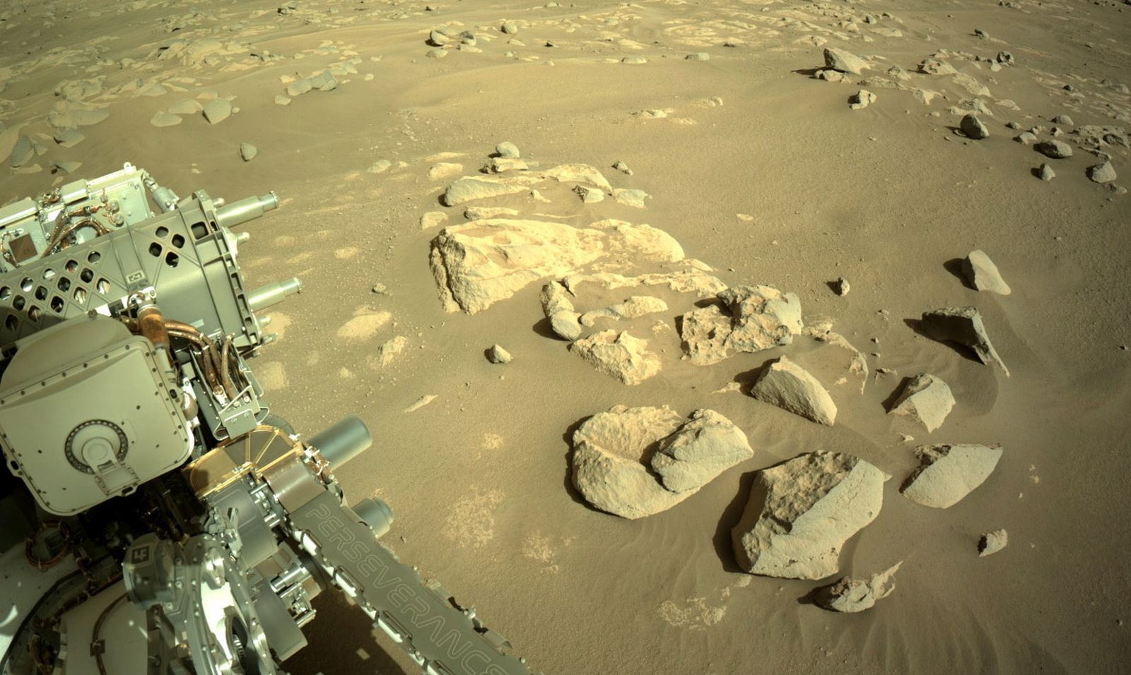 epa09134316 A handout photo made available by NASA shows the landscape surrounding NASA's Perseverance Mars rover, on Sol 52, 13 April 2021 (issued 14 April 2021). NASA's Mars Perseverance rover acquired this image using its onboard Right Navigation Camera (Navcam). Having landed on Mars on 18 February, Perseverance's main mission on Mars is astrobiology and the search for signs of ancient microbial life, according to NASA.  EPA/NASA/JPL-Caltech/HANDOUT  HANDOUT EDITORIAL USE ONLY/NO SALES