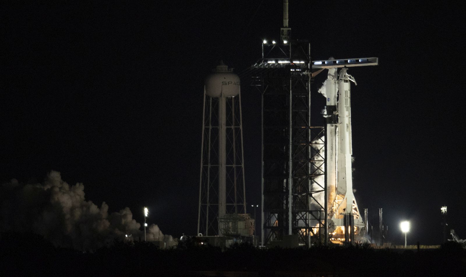 epa09141083 A handout photo made available by NASA shows A SpaceX Falcon 9 rocket with the company's Crew Dragon spacecraft onboard is seen on the launch pad at Launch Complex 39A during a brief static fire test ahead of NASA's SpaceX Crew-2 mission, at NASA's Kennedy Space Center in Cape Canaveral, Florida, USA, 17 April 2021. NASA's SpaceX Crew-2 mission is the second crew rotation mission of the SpaceX Crew Dragon spacecraft and Falcon 9 rocket to the International Space Station as part of the agency’s Commercial Crew Program. NASA astronauts Shane Kimbrough and Megan McArthur, ESA (European Space Agency) astronaut Thomas Pesquet, and Japan Aerospace Exploration Agency (JAXA) astronaut Akihiko Hoshide are scheduled to launch at 6:11 a.m. ET on Thursday, April 22, from Launch Complex 39A at the Kennedy Space Center.  EPA/JOEL KOWSKY / NASA / HANDOUT MANDATORY CREDIT: JOEL KOWSKY / NASA HANDOUT EDITORIAL USE ONLY/NO SALES