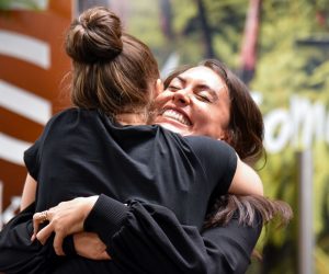 epa09144505 Families and loved ones embrace after landing on the first Air New Zealand flight to land, on the first day of the trans-Tasman bubble, in Wellington, New Zealand, 19 April 2021.  EPA/BEN MCKAY  AUSTRALIA AND NEW ZEALAND OUT