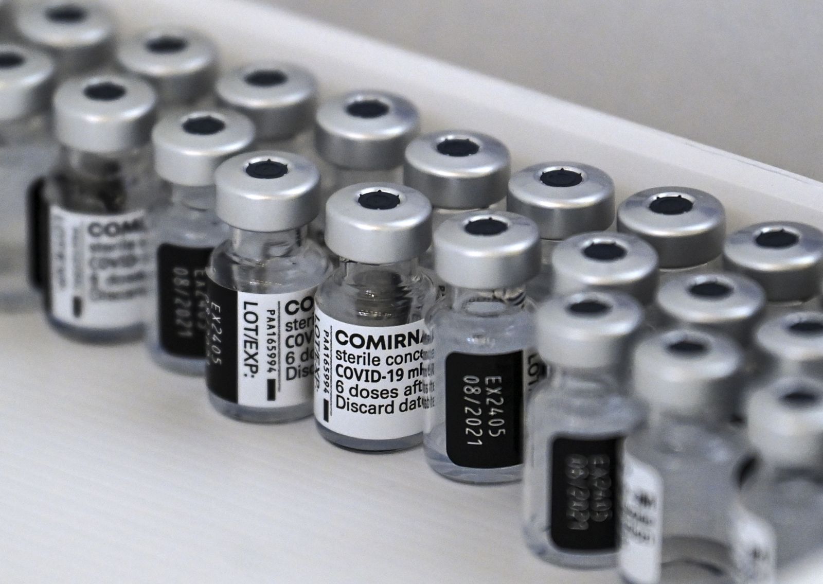 epa09154598 Empty bottles of of Pfizer-BioNTech COVID-19 vaccine seen in the box during the vaccination at the Arena 'Boris Trajkoovski' in Skopje, Republic of North Macedonia, 23 April 2021. Members of Macedonian Parliament received first dose of Russian Sputnik V vaccine on 23 April as the country continues its coronavirus disease (COVID-19) vaccination campaign with elderly people and critical groups for the state infrastructure.  EPA/GEORGI LICOVSKI