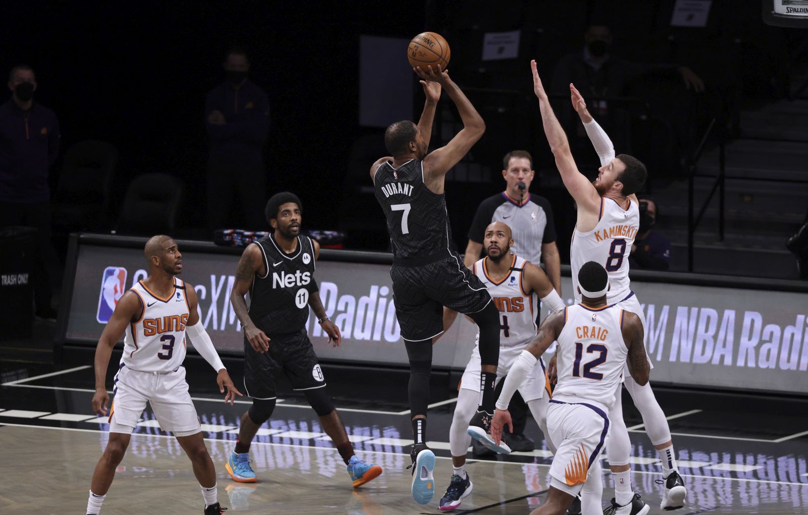 epa09159495 The Nets' Kevin Durant (3-L) shoots as the Suns' (L-R) Chris Paul, Jevon Carter, Torrey Craig and Frank Kaminsky defend and teammate Kyrie Irving (2-L) looks on during the first half of the game between the Phoenix Suns and the Brooklyn Nets at the Barclays Center in Brooklyn borough of New York, New York, USA, 25 April 2021.  EPA/JUSTIN LANE  SHUTTERSTOCK OUT