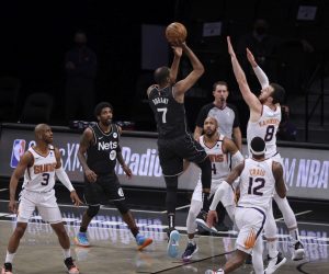 epa09159495 The Nets' Kevin Durant (3-L) shoots as the Suns' (L-R) Chris Paul, Jevon Carter, Torrey Craig and Frank Kaminsky defend and teammate Kyrie Irving (2-L) looks on during the first half of the game between the Phoenix Suns and the Brooklyn Nets at the Barclays Center in Brooklyn borough of New York, New York, USA, 25 April 2021.  EPA/JUSTIN LANE  SHUTTERSTOCK OUT