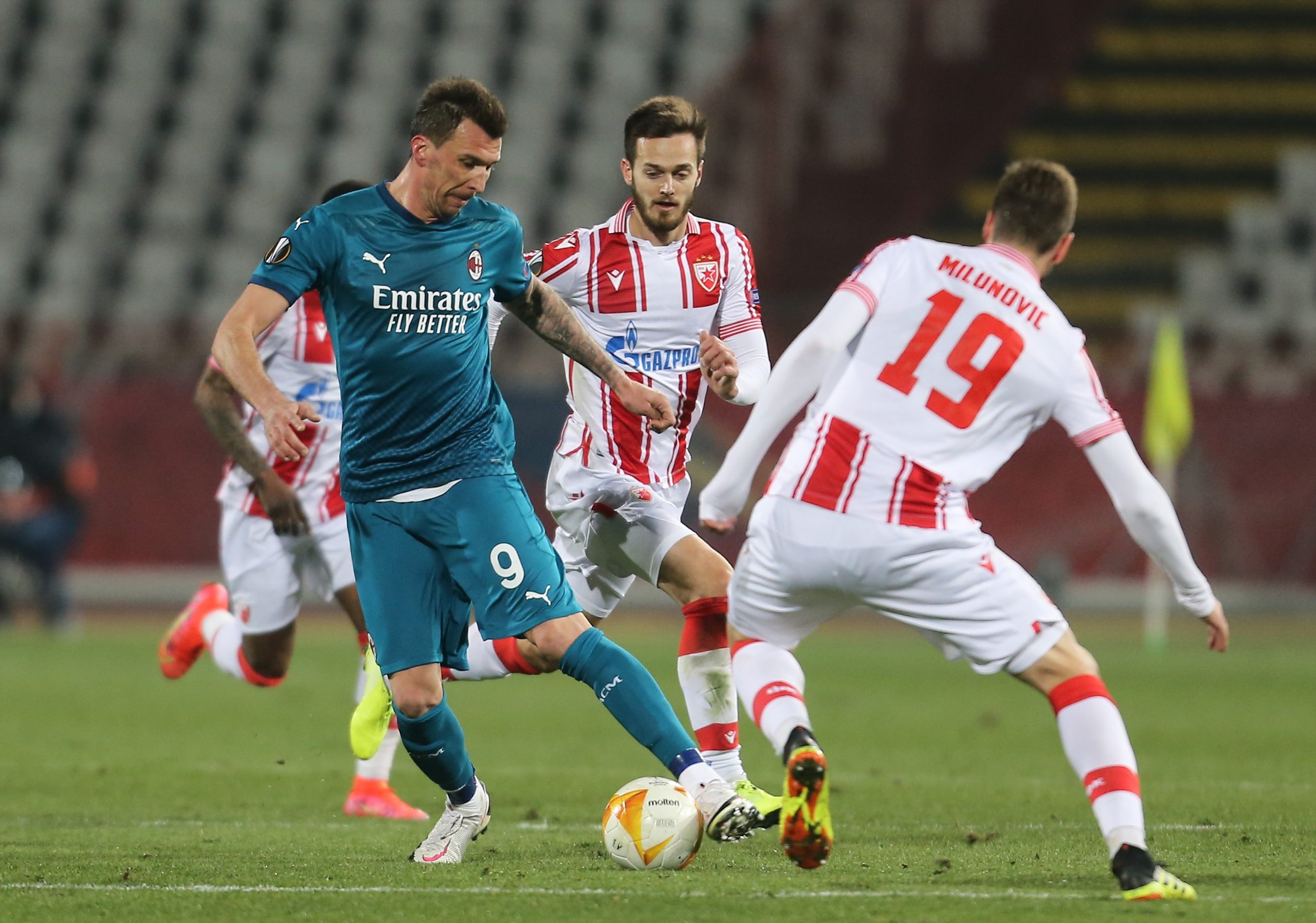 18, February, 2021, Belgrade - The first match of the sixteenth final of the Europa League between FC Red Star and AC Milan was played at the "Rajko Mitic" stadium. Mario Mandzukic, #9 (AC Milan), Mirko Ivanic, #4 (FK Crvena zvezda),  Nemanja Milunovic, #19 (FK Crvena zvezda). Photo: M.M./ATAImages

18, februar, 2021, Beograd - Prva utakamice sesnaestine finala Liga Evrope izmedju FK Crvena zvezda i AC Milan odigrana je na stadionu "Rajko Mitic". Photo: M.M./ATAImages