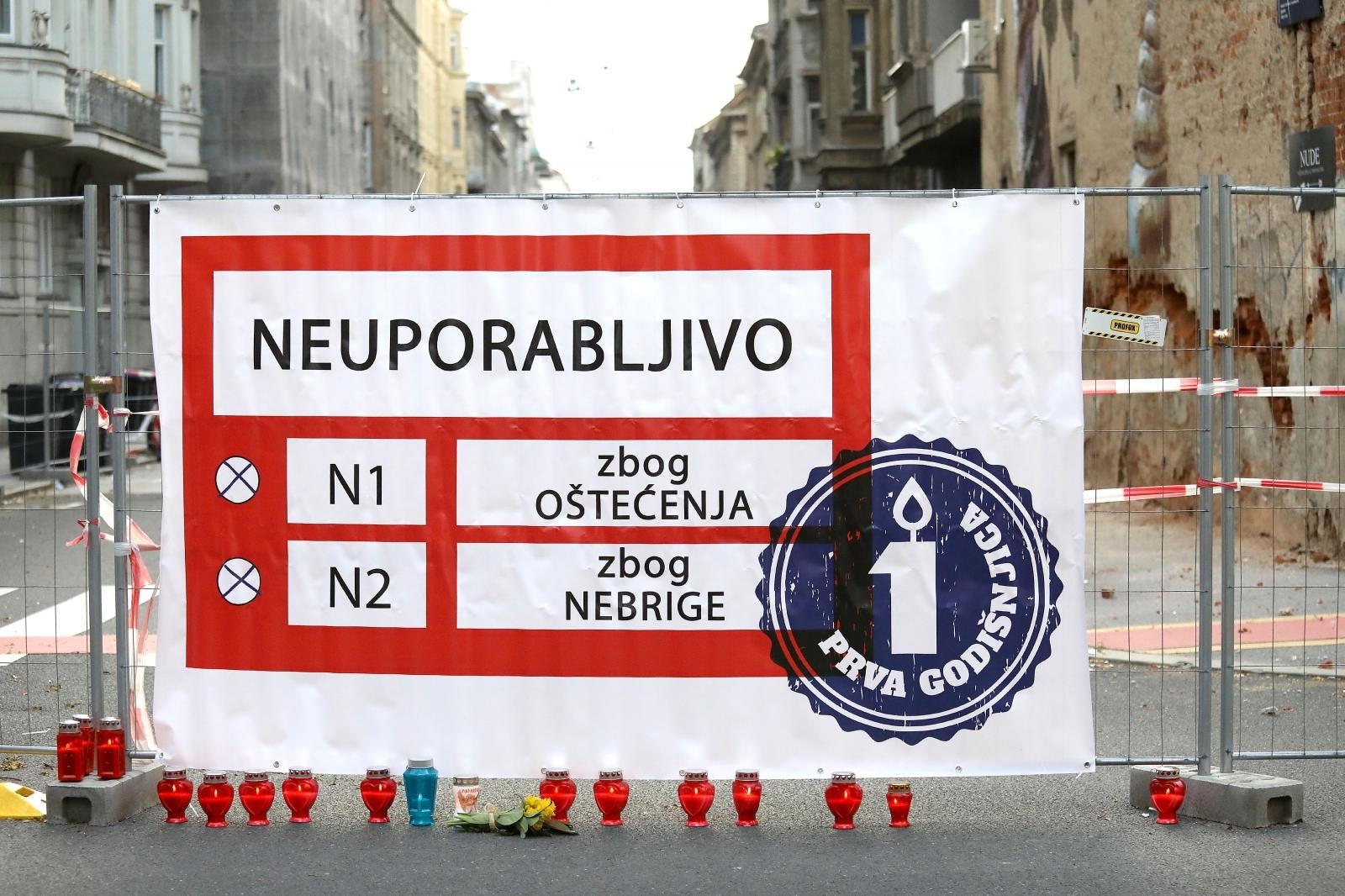 22.03.2021., Zagreb - Osnivaci udruge SOS Zagreb okupili su se na dan prve godisnjice potresa u 6,24 sati na uglu Djordjiceve i Petrinjske ulice ispred zgrade simbola zagrebackog potresa i zapalili svijece "za sve zrtve zakona o obnovi". 
Photo: Patrik Macek/PIXSELL