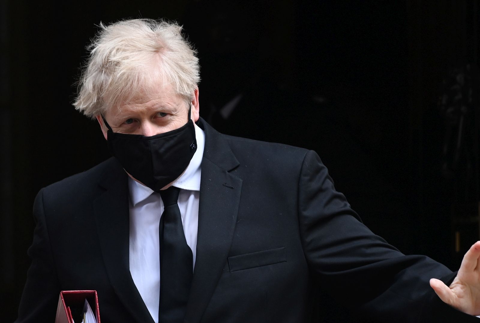 epa09134628 British Prime Minister Boris Johnson departs 10 Downing Street for Prime Minister Questions at parliament in London, Britain, 14 April 2021.  EPA/ANDY RAIN