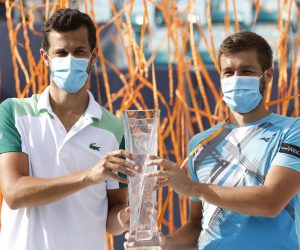epa09114695 Nikola Mektic (R) and Mate Pavic (L) of Croatia hold their winner's trophy against Neal Skupski and Daniel Evans of Great Britain during their Men's Doubles Finals match at the Miami Open tennis tournament in Miami Gardens, Florida, USA, 03 April 2021.  EPA/RHONA WISE