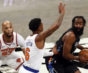 epa09117731 Brooklyn Nets guard James Harden (R) looks to pass around New York Knicks guard Elfrid Payton (C) and teammate New York Knicks center Taj Gibson (L) in the first half of the NBA basketball game between the New York Knicks and the Brooklyn Nets at the Barclays Center in Brooklyn, New York, USA, 05 April 2021.  EPA/JASON SZENES SHUTTERSTOCK OUT