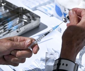 epa09154595 A medical staff prepares dose of Pfizer-BioNTech COVID-19 vaccine during the vaccination at the Arena 'Boris Trajkoovski' in Skopje, Republic of North Macedonia, 23 April 2021. Members of Macedonian Parliament received first dose of Russian Sputnik V vaccine on 23 April as the country continues its coronavirus disease (COVID-19) vaccination campaign with elderly people and critical groups for the state infrastructure.  EPA/GEORGI LICOVSKI