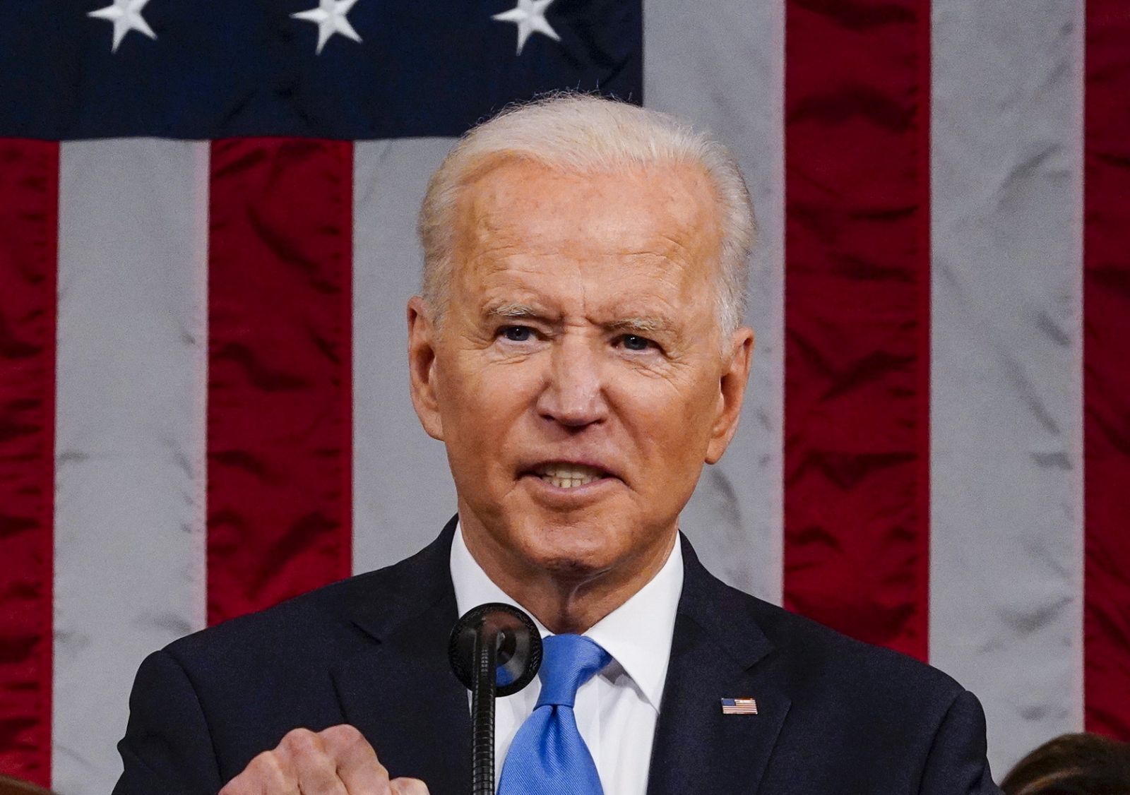 epa09166681 US President Joe Biden addresses a joint session of Congress, with Vice President Kamala Harris and House Speaker Nancy Pelosi (D-Calif.) sitting behind him, at the Capitol in Washington, DC, USA, 28 April 2021. The speech was Biden's first since taking office in January.  EPA/MELINA MARA / POOL