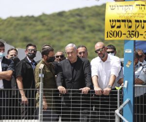 epa09169055 Israeli Prime Minister Benjamin Netanyahu (C) visits Mount Meron, northern Israel, where fatalities were reported among the thousands of ultra-Orthodox Jews gathered at the tomb of a 2nd-century sage for annual commemorations that include all-night prayer and dance, in Mount Meron, Israel, 30 April 2021. Dozens of people were killed and injured in the revelry complex on Mount Meron, after an apparent stampede occured during an event marking the end of the Jewish holiday of Lag Ba'Omer, the day marks the anniversary of the death of Rabbi Shimon bar Yochai, a sage from some 1,800 years ago, and the day on which he revealed the secrets of the 'kabbalah,' or Jewish mysticism.  EPA/RONEN ZVULUN / POOL
