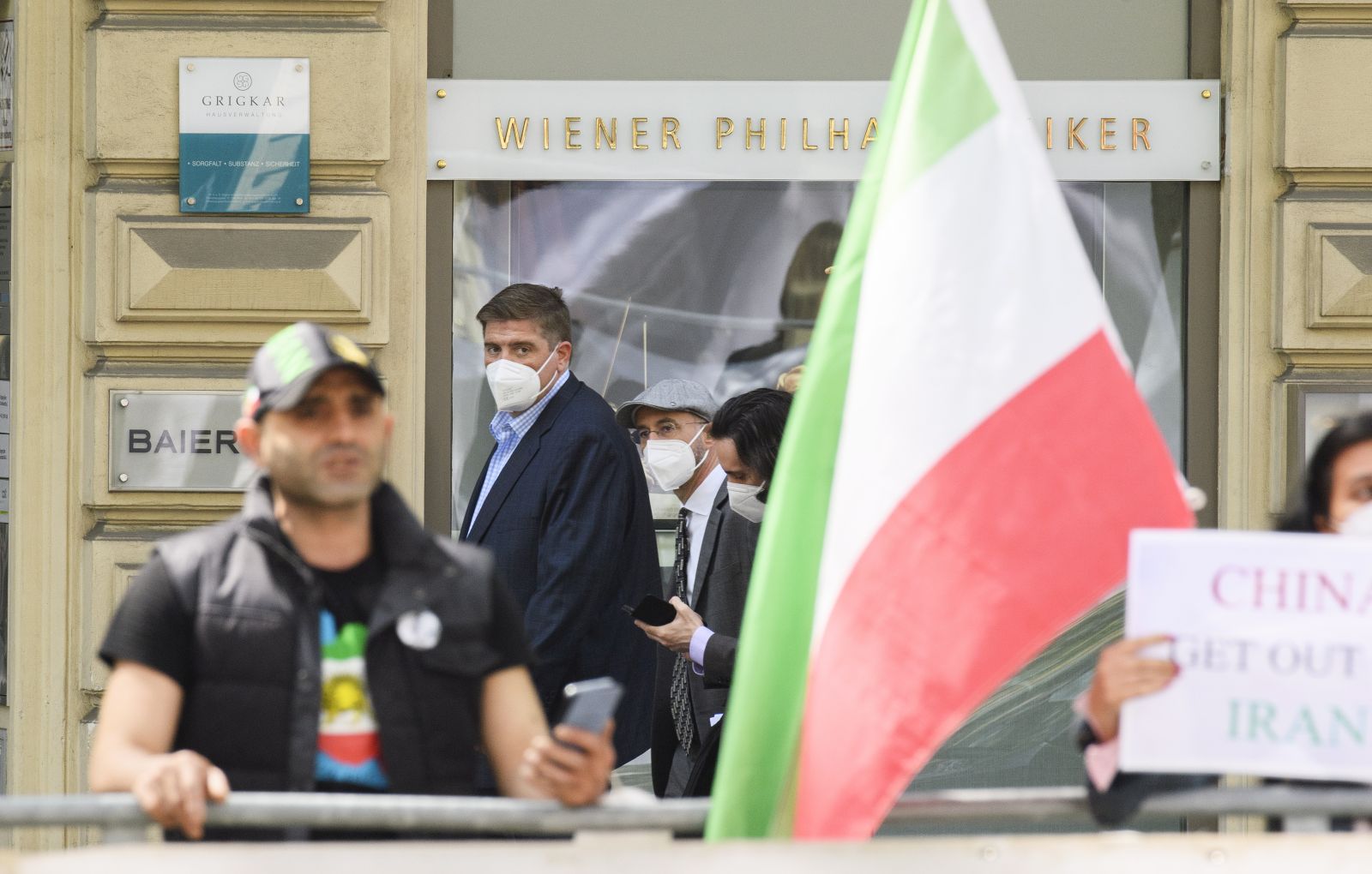 epa09171049 Robert Malley, US Special Envoy for Iran, passes by protesters of an Iranian opposition group after a bilateral meeting for the JCPOA Joint Commission Iran talks meeting in Vienna, Austria, 01 May 2021. The Joint Commission of the Joint Comprehensive Plan of Action (JCPOA) at a Deputy Foreign Ministers and Political Directors' level is chaired on behalf of EU High Representative Josep Borrell, by the EEAS Deputy Secretary General Enrique Mora and is attended by China, France, Germany, Russia, Britain and Iran.  EPA/CHRISTIAN BRUNA