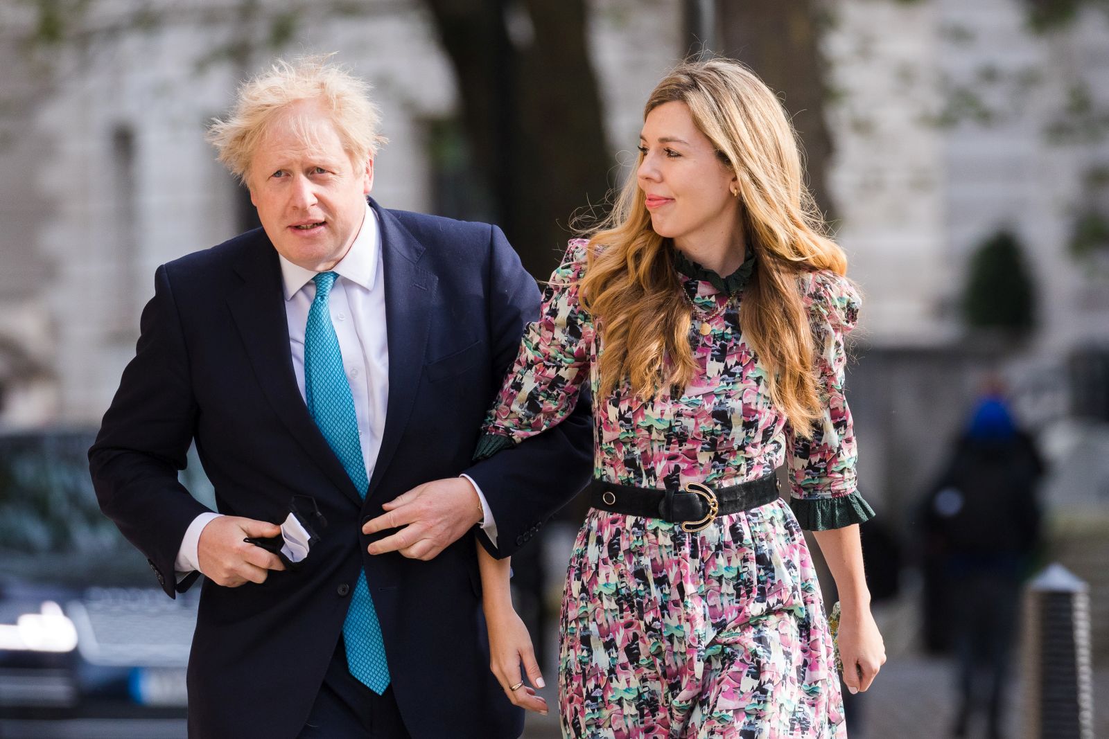 epa09180225 Britain's Prime Minster Boris Johnson (L) and his partner Carrie Symonds arrive at a polling station to cast their votes for the local elections in London, Britain, 06 May 2021. Britons go to the polls on 06 May 2021 to vote in local and mayoral elections.  EPA/VICKIE FLORES