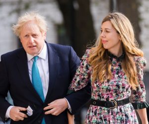 epa09180225 Britain's Prime Minster Boris Johnson (L) and his partner Carrie Symonds arrive at a polling station to cast their votes for the local elections in London, Britain, 06 May 2021. Britons go to the polls on 06 May 2021 to vote in local and mayoral elections.  EPA/VICKIE FLORES