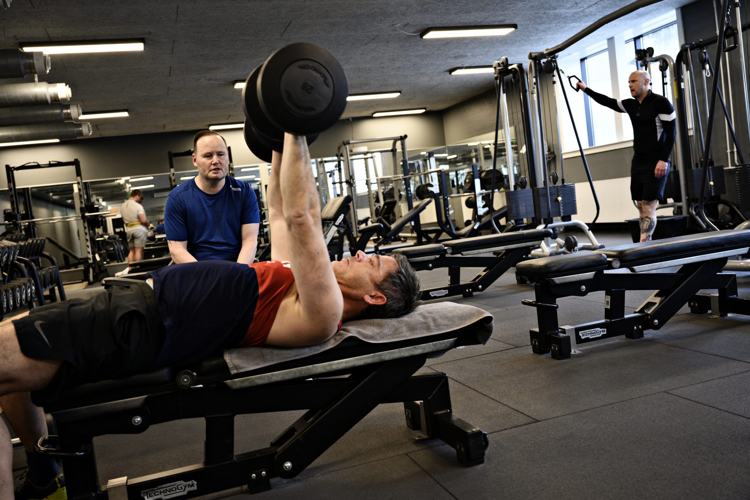 epa09180437 Peole train in a fitness center in Copenhagen, Denmark, 06 May 2021. Denmark eases its lockdown restrictions in fitness centers from 06 May 2021.  EPA/PHILIP DAVALI  DENMARK OUT