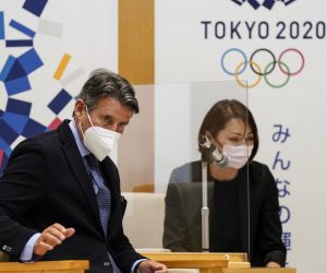 epa09182226 Sebastian Coe (L), World Athletics President, listens to Tokyo Governor Yuriko Koike during their meeting at the Tokyo Metropolitan Government office in Tokyo, Japan, 07 May 2021.  EPA/KIMIMASA MAYAMA