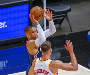 epa09190455 Washington Wizards guard Russell Westbrook (L) shoots as Atlanta Hawks guard Bogdan Bogdanovic (R) of Serbia guards during the first half of the NBA basketball game between the Washington Wizards and the Atlanta Hawks at State Farm Arena in Atlanta, Georgia, USA, 10 May 2021.  EPA/ERIK S. LESSER SHUTTERSTOCK OUT