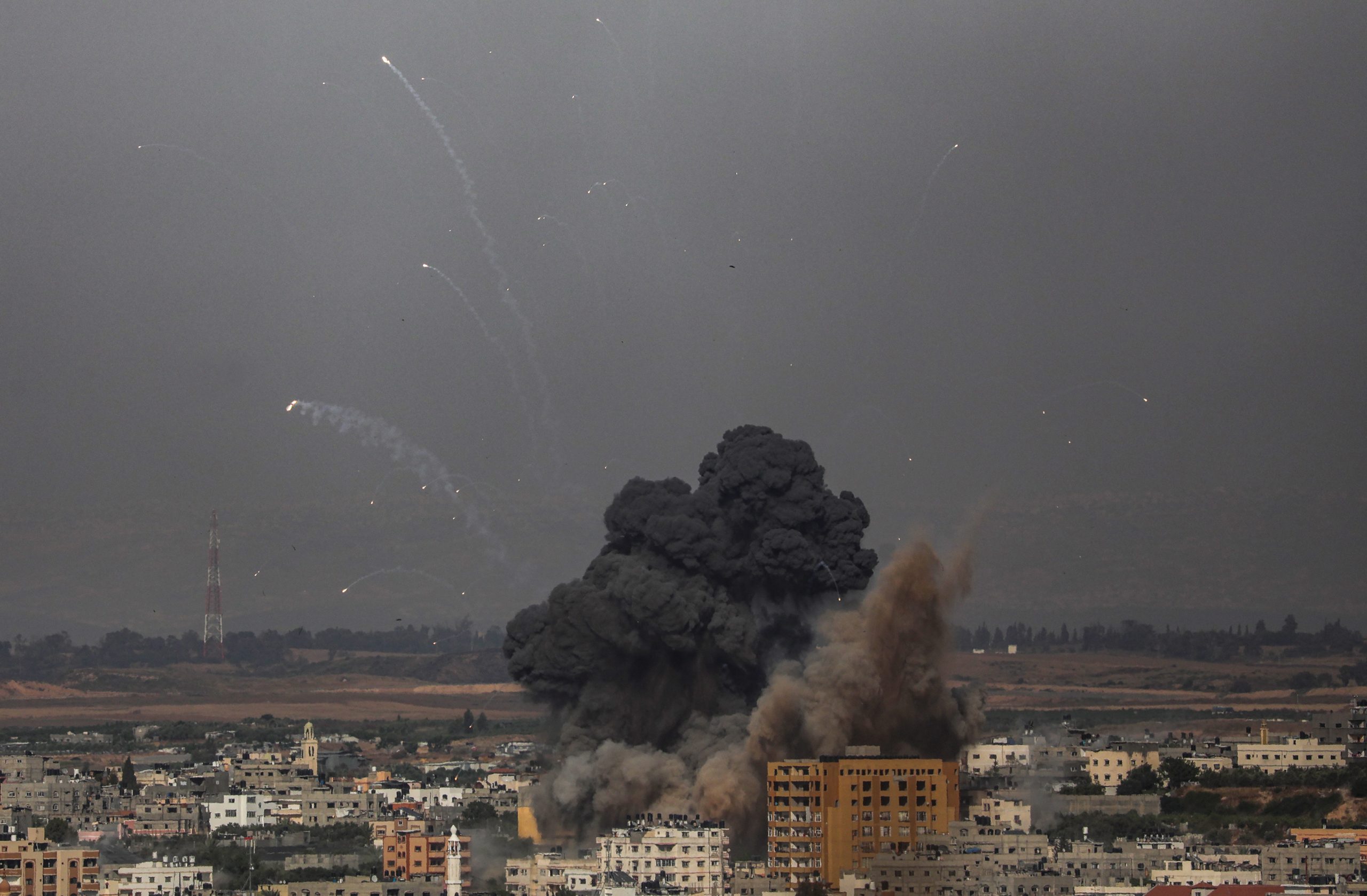 epa09192784 Smoke rises after an Israeli airstrike in Gaza City, 11 May 2021. At least one woman was killed after 130 rockets fired by Hamas from Gaza strip fell on Tel Aviv and neighbouring Israeli cities. A day earlier and in response to days of violent confrontations between Israeli security forces and Palestinians in Jerusalem, various Palestinian militants factions in Gaza launched rocket attacks that killed two Israelis in the city of Ashkelon. Israel Defense Forces (IDF) said they hit over 100 targets in Gaza Strip during retaliatory overnight strikes. The Health Ministry of Gaza strip said that at least 26 Palestinian, including nine children, were killed from the Israeli airstrikes. Israeli Prime Minister Benjamin Netanyahu said on 11 May that they will increase the rate and intensity of the strikes.  EPA/MOHAMMED SABER