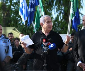 epa09197056 Israeli Prime Minister Benjamin Netanyahu (C) delivers a speech as he meets with Israeli border police, after a wave of violence in the city between Arab and Jewish in the Israeli city of Lod, near Tel Aviv, Israel, 13 May 2021.  EPA/YUVAL CHEN / POOL