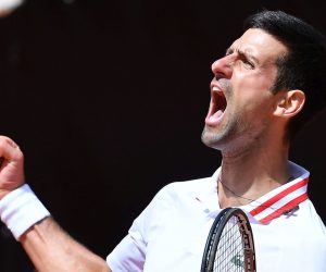 epa09201128 Novak Djokovic of Serbia reacts during his men's singles quarterfinal match against Stefanos Tsitsipas of Greece at the Italian Open tennis tournament in Rome, Italy, 15 May 2021.  EPA/ETTORE FERRARI
