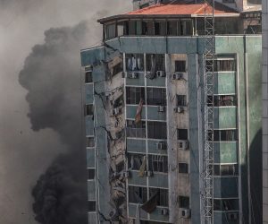 epa09201670 Smoke rises after an Israeli airstrike hits Al-Jalaa tower, which houses apartments and several media outlets, including The Associated Press and Al Jazeera, in Gaza City, 15 May 2021. In response to days of violent confrontations between Israeli security forces and Palestinians in Jerusalem, various Palestinian militants factions in Gaza launched rocket attacks since 10 May that killed at least nine Israelis to date. According to the Palestinian Ministry of Health, at least 139 Palestinians, including 39 children, were killed in the recent retaliatory Israeli airstrikes.  EPA/MOHAMMED SABER