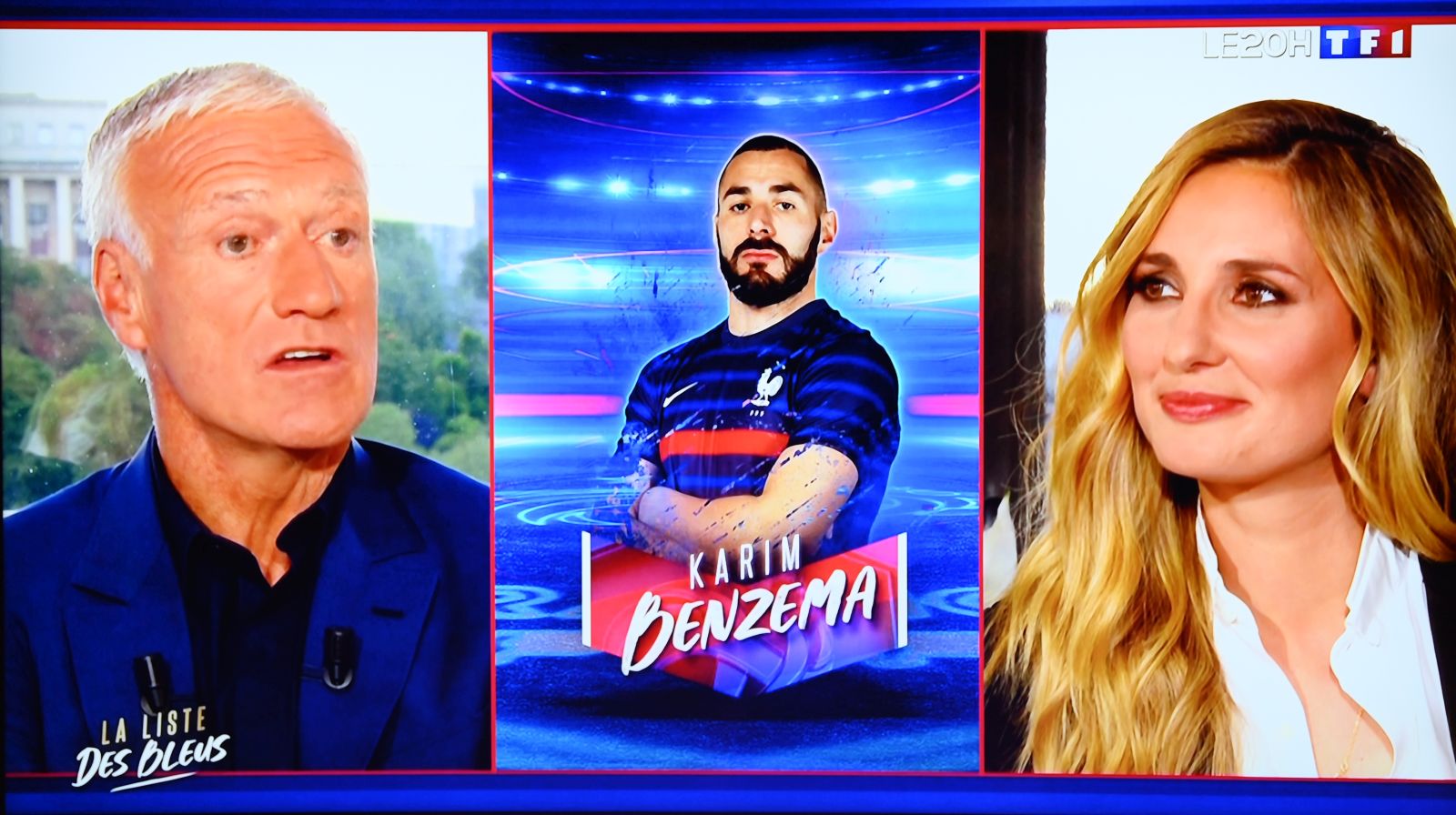 epa09209714 A portrait of France's forward Karim Benzema (C) is displayed as France's head coach Didier Deschamps (L), flanked by French journalist Marie Portolano, announces the France’s squad list for the UEFA Euro 2020 football tournament, on the TV set of French television channel TF1 in Boulogne Billancourt, on the outskirts of Paris, France, 18 May 2021.  EPA/FRANCK FIFE / POOL  MAXPPP OUT