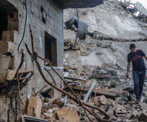 epa09213606 A Palestinian man inspects the rubble of his destroyed house after israeli airstrikes, in Gaza City, 19 May 2021. Clashes erupted 06 May over the forced eviction of six Palestinian families from their homes in Sheikh Jarrah neighborhood in favor of Jewish families who claimed they used to live in the houses before fleeing in the 1948 war that led to the creation of Israel. In response to days of violent confrontations between Israeli security forces and Palestinians in Jerusalem, various Palestinian militants factions in Gaza launched rocket attacks since 10 May that killed at least 12 Israelis to date. The Palestinian health ministry said that at least 219 Palestinians, including 63 children, were killed in the retaliatory Israeli airstrikes.  EPA/MOHAMMED SABER