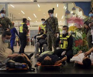 epa09225538 Rescue personnel help injured passengers at KLCC station after an accident involving Kuala Lumpur Light Rail Transit (LRT) trains in Kuala Lumpur, Malaysia, 24 May 2021. More than 230 people were injured after two LRT trains collided in a tunnel in Kuala Lumpur.  EPA/STR MALAYSIA OUT