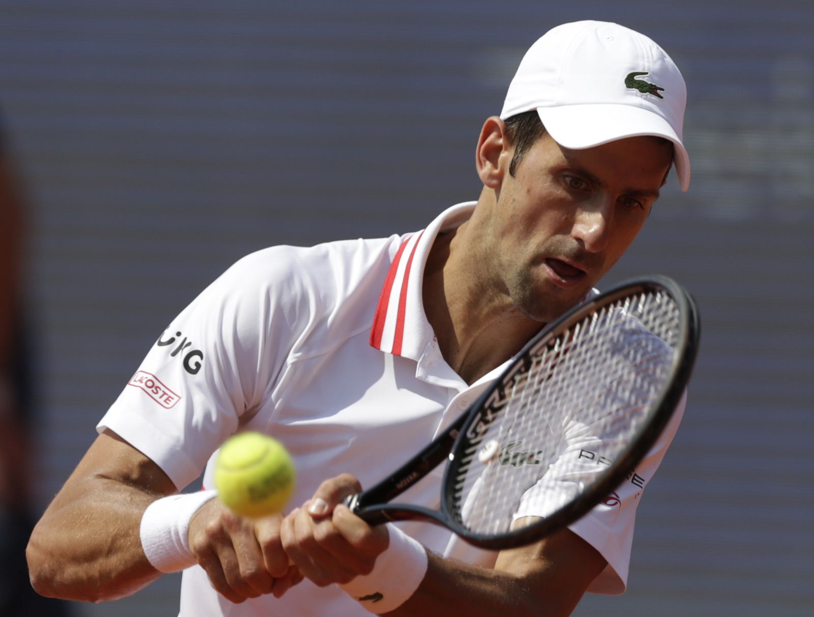 epa09226803 Novak Djokovic of Serbia in action against Mats Moraing of Germany during their second round match of the Belgrade Open tennis tournament in Belgrade, Serbia, 25 May 2021.  EPA/ANDREJ CUKIC