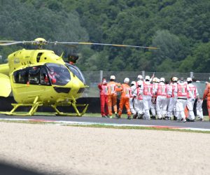 epa09235010 Swiss Jason Dupasquier of Moto3 receives medical assistance after crashing during the qualifying session of the Motorcycling Grand Prix of Italy at the Mugello circuit in Scarperia, central Italy, 29 May 2021.  EPA/CLAUDIO GIOVANNINI