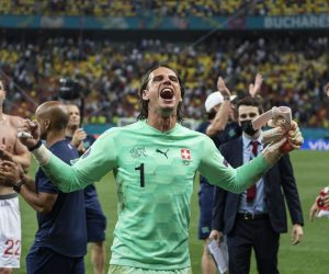 Switzerland's goalkeeper Yann Sommer celebrates after a penalty shootout at the end of the Euro 2020 soccer championship round of 16 match between France and Switzerland at the National Arena stadium, in Bucharest, Romania, Monday, June 28, 2021. Switzerland won on penalties after the match ended 3-3. (Jean-Christophe Bott/Keystone via AP)