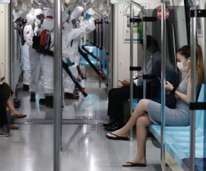 epa09226737 Passengers sit apart inside a train in Taipei, Taiwan, 25 May 2021. Due to the rising number of domestically transmitted Covid-19 cases, Taiwan extended the nationwide COVID-19 alert level 3 to 14 June from the original date which is 28 May.  EPA/RITCHIE B. TONGO
