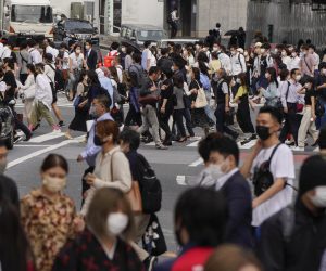 epa09232787 Pedestrians walk along the Shibuya scramble crossway in Tokyo, Japan, 28 May 2021. Japanese Prime Minister Yoshihide Suga decided to extend a state of emergency for the COVID-19 coronavirus pandemic in nine prefectures including Tokyo until 20 June 2021, originally scheduled until 31 May. Suga will announce the decision at a televised news conference later on 28 May 2021. Some opinion polls by Japanese media show more than 80 percent of people support the cancellation or postponement of the Tokyo 2020 Olympic Games while Japanese people who have been vaccinated at least once is about six percent. It is said Japan's vaccination rate is very low, the lowest among OECD member countries.  EPA/KIMIMASA MAYAMA