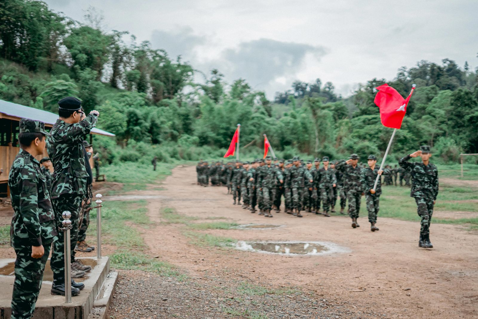 epa09236589 A handout photo made available by the National Unity Government (NGU) shows soldiers from the People's Defence Force (PDF) standing in formation during the closing ceremony of the first batch training of the PDF at an undisclosed location in Myanmar, 25 May 2021 (issued on 30 May 2021). The National Unity Government (NUG), Myanmar's shadow government, said it has finished training the first batch recruits for the People's Defence Force (PDF) to challenge Myanmar's junta. Myanmar's military authorities have labelled both NUG and PDF as terrorist groups.  EPA/NATIONAL UNITY GOVERNMENT HANDOUT EDITORS NOTE: FACES OF RECRUITS BLURRED AT SOURCE. HANDOUT EDITORIAL USE ONLY/NO SALES