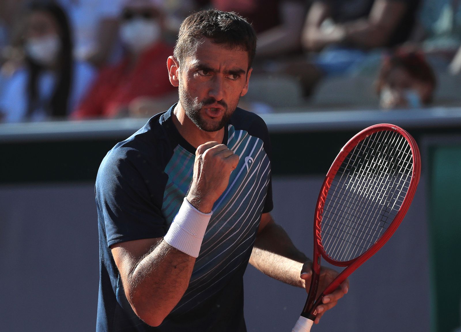 epa09239564 Marin Cilic of Croatia reacts during his first round match against Arthur Rinderknech of France at the French Open tennis tournament at Roland Garros in Paris, France, 31 May 2021.  EPA/CHRISTOPHE PETIT TESSON