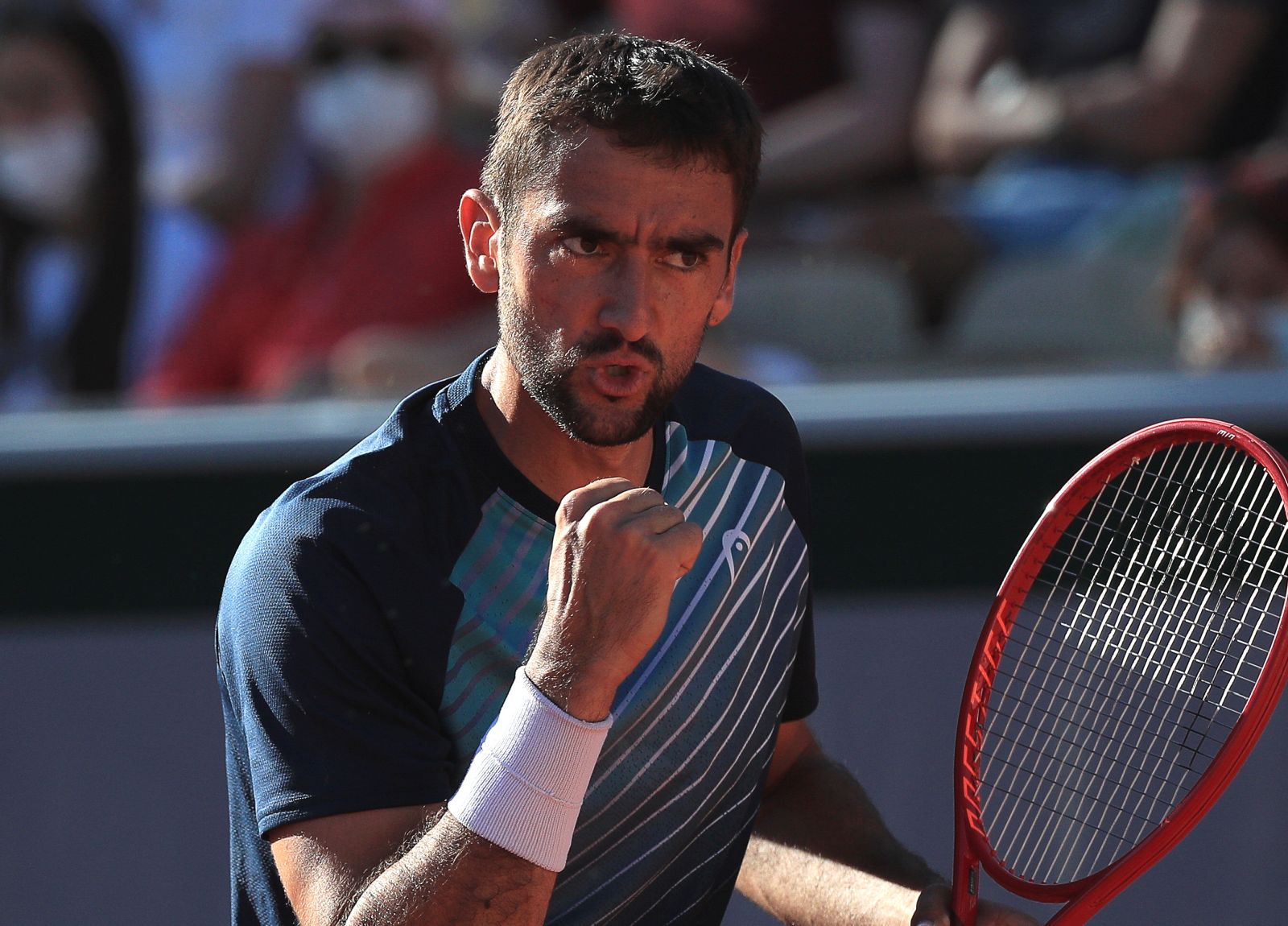 epa09239564 Marin Cilic of Croatia reacts during his first round match against Arthur Rinderknech of France at the French Open tennis tournament at Roland Garros in Paris, France, 31 May 2021.  EPA/CHRISTOPHE PETIT TESSON