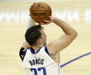 epa09244227 Dallas Mavericks forward-guard Luka Doncic scores a three pointer during the first quarter of the game 5 of the NBA playoffs between the Dallas Mavericks and the Los Angeles Clippers at the Staples Center in Los Angeles, California, USA, 02 June 2021.  EPA/ETIENNE LAURENT SHUTTERSTOCK OUT