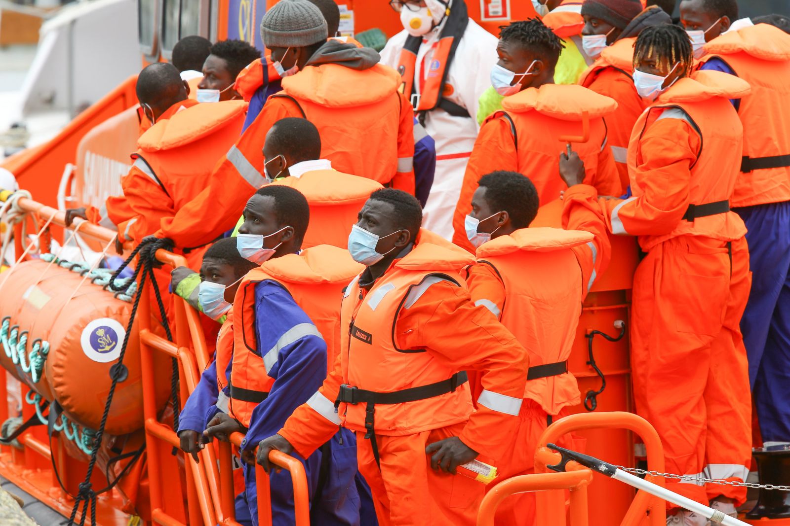 epa09255268 Sub Saharan migrants arrive in a Maritime Rescue boat to Arguineguin harbor, in Gran Canaria, Canary Islands, Spain, 08 June 2021. These migrants were rescued during the night by British M/V Anvil Point cargo ship while traveling near Dakhla (Western Sahara).  EPA/Elvira Urquijo A.