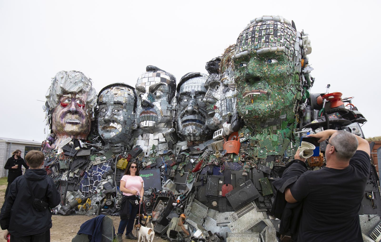 epa09260257 Members of the public visit the 'Mount Recyclemore' sculpture depicting the G7 leaders at Sandy Acres, St Ives, Cornwall, Britain, 10 June 2021. Artist Joe Rush has created sculptures of the G7 leaders inspired by Mount Rushmore. The artwork is made from discarded electronics illustrating the growing problem of e-waste. Britain is hosting the G7 summit in Cornwall from 11 to 13 June 2021.  EPA/JON ROWLEY