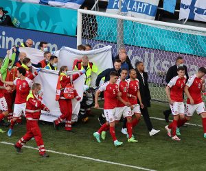 epa09265402 Christian Eriksen of Denmark receives medical attention during the UEFA EURO 2020 group B preliminary round soccer match between Denmark and Finland in Copenhagen, Denmark, 12 June 2021.  EPA/Wolfgang Rattay / POOL (RESTRICTIONS: For editorial news reporting purposes only. Images must appear as still images and must not emulate match action video footage. Photographs published in online publications shall have an interval of at least 20 seconds between the posting.)