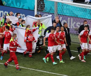 epa09265402 Christian Eriksen of Denmark receives medical attention during the UEFA EURO 2020 group B preliminary round soccer match between Denmark and Finland in Copenhagen, Denmark, 12 June 2021.  EPA/Wolfgang Rattay / POOL (RESTRICTIONS: For editorial news reporting purposes only. Images must appear as still images and must not emulate match action video footage. Photographs published in online publications shall have an interval of at least 20 seconds between the posting.)