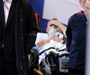 epa09265622 Christian Eriksen (C) of Denmark is stretchered off the pitch after receiving medical assistance during the UEFA EURO 2020 group B preliminary round soccer match between Denmark and Finland in Copenhagen, Denmark, 12 June 2021.  EPA/Friedemann Vogel / POOL (RESTRICTIONS: For editorial news reporting purposes only. Images must appear as still images and must not emulate match action video footage. Photographs published in online publications shall have an interval of at least 20 seconds between the posting.)