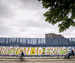 epa09270086 A mural dedicated to Danish national soccer team player Christian Eriksen reads 'Christian 10 Eriksen' followed by '1 for All - All for 1' in Danish next to the Rigshospitalet in Copenhagen, Denmark, 14 June 2021. Eriksen collapsed on the pitch towards the end of the first half of the UEFA EURO 2020 match between Denmark and Finland on 12 June and received medical treatment on the pitch before being stretchered off and rushed to the Rigshospitalet where continues to be hospitalized.  EPA/Mads Claus Rasmussen  DENMARK OUT