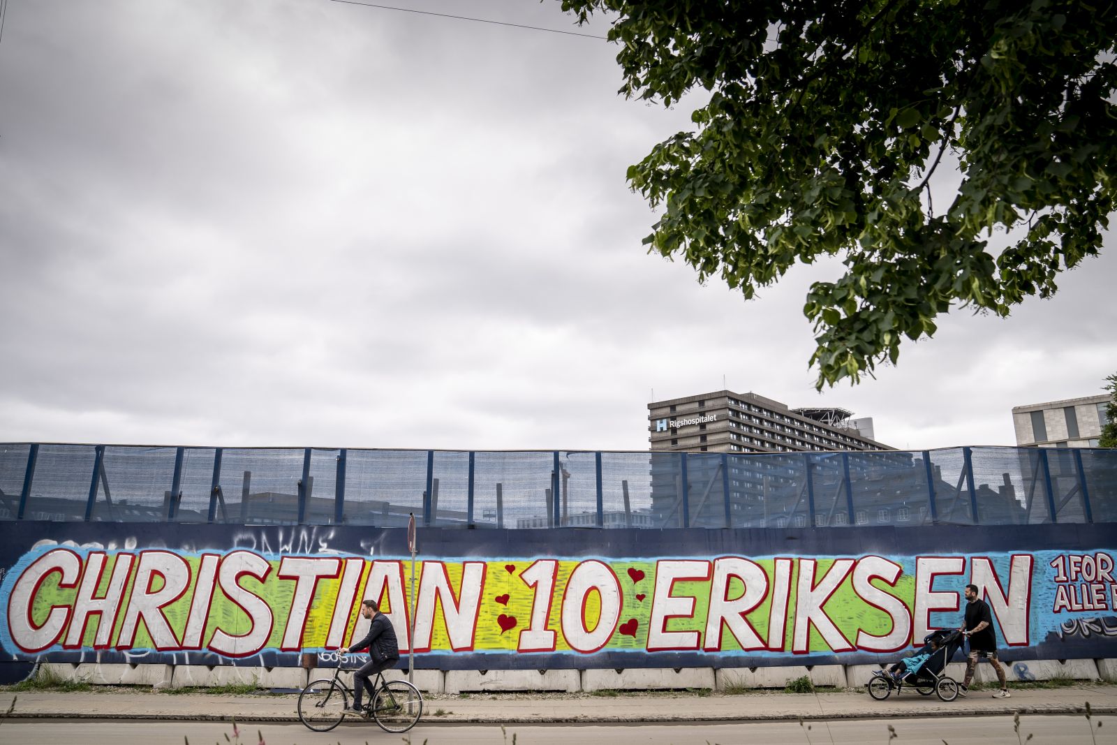 epa09270086 A mural dedicated to Danish national soccer team player Christian Eriksen reads 'Christian 10 Eriksen' followed by '1 for All - All for 1' in Danish next to the Rigshospitalet in Copenhagen, Denmark, 14 June 2021. Eriksen collapsed on the pitch towards the end of the first half of the UEFA EURO 2020 match between Denmark and Finland on 12 June and received medical treatment on the pitch before being stretchered off and rushed to the Rigshospitalet where continues to be hospitalized.  EPA/Mads Claus Rasmussen  DENMARK OUT