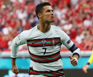 epa09274032 Cristiano Ronaldo of Portugal celebrates after scoring his team's second goal during the UEFA EURO 2020 group F preliminary round soccer match between Hungary and Portugal in Budapest, Hungary, 15 June 2021.  EPA/Bernadett Szabo / POOL (RESTRICTIONS: For editorial news reporting purposes only. Images must appear as still images and must not emulate match action video footage. Photographs published in online publications shall have an interval of at least 20 seconds between the posting.)