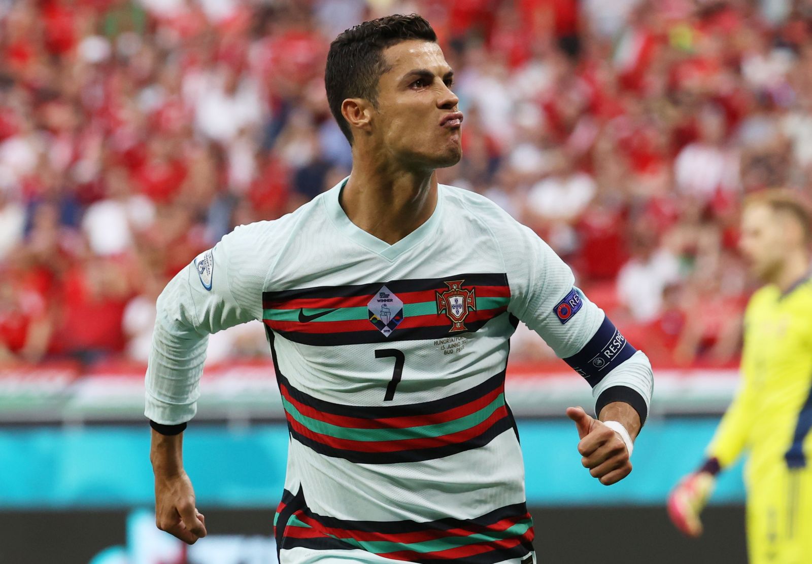 epa09274032 Cristiano Ronaldo of Portugal celebrates after scoring his team's second goal during the UEFA EURO 2020 group F preliminary round soccer match between Hungary and Portugal in Budapest, Hungary, 15 June 2021.  EPA/Bernadett Szabo / POOL (RESTRICTIONS: For editorial news reporting purposes only. Images must appear as still images and must not emulate match action video footage. Photographs published in online publications shall have an interval of at least 20 seconds between the posting.)